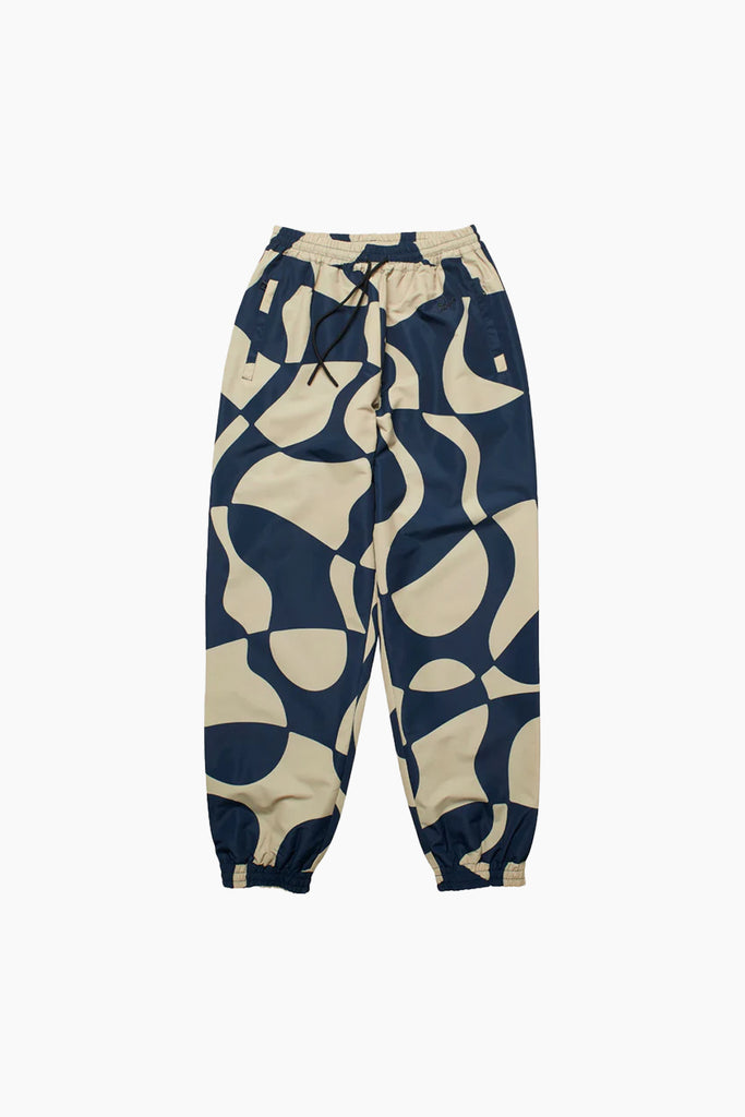 navy and beige distorted pattern on a nylon track pant with elasticated ankles and waistband with front side pockets and back pockets from by parra