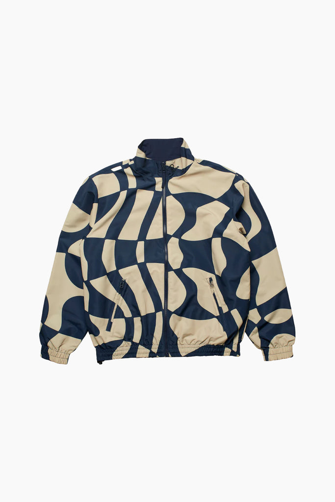by parra front image of track jacket with navy and beige distorted pattern, two zip pockets on front sides, with elasticated wrists and waistband