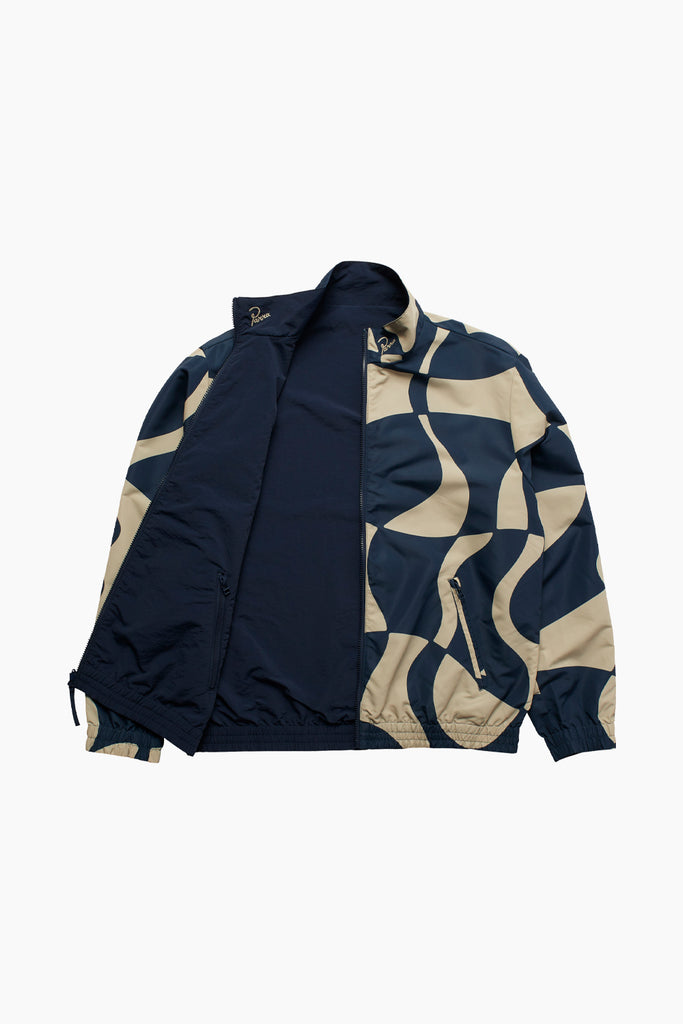 by parra reversible zoom winds jacket showing the jacket open with the navy side exposed. Both "Parra" neck embroideries are subtly placed on the left side of the neck.